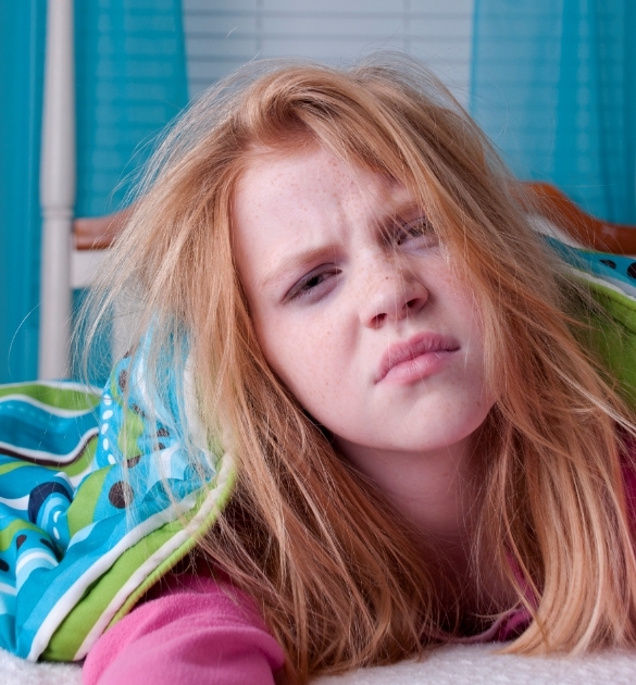 Girl not wanting to wake up for back to school.