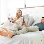 Couple laying on a bed