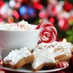 Festive mug with candy and cookies