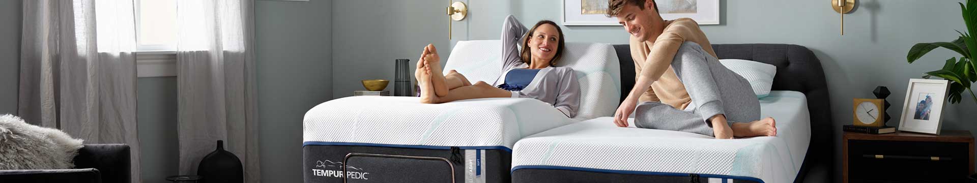 Man and women on a king mattress dual adjustable Tempur-Pedic