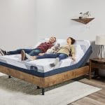 Man and woman laying on an adjustable bed comfortably