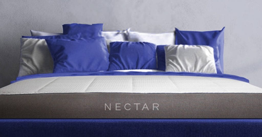 Nectar mattress with blue and white pillows