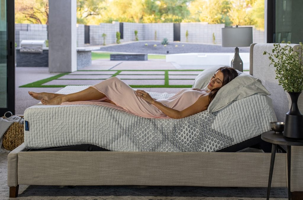 King Koil Lily SmartLife Medium mattress with a women laying on it