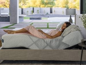 King Koil Lily SmartLife Medium mattress with a women laying on it