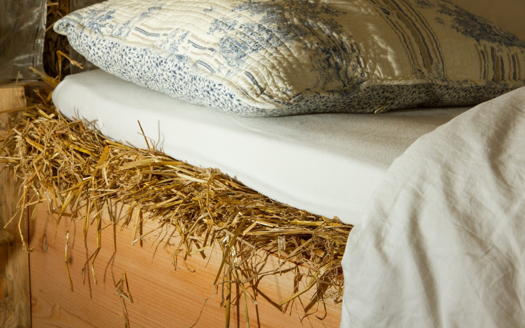 Bed on top of a haystack