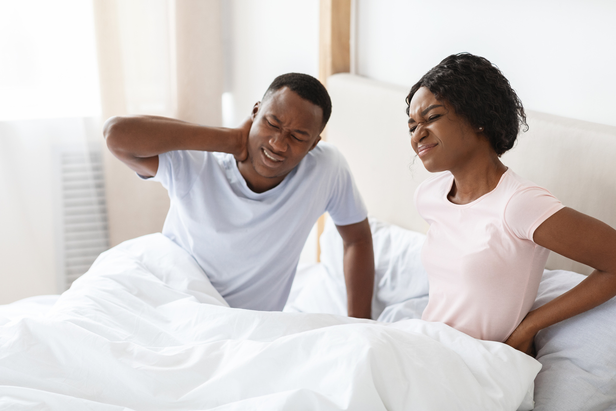 Couple in bed after uncomfortable sleep