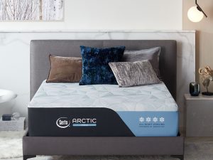 Serta Arctic Hybrid in a room with pillows