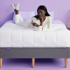 woman laying on a Purple Mattress with Purple bed frame