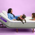woman and dog laying on Purple Premier 4 Mattress girl leaning on mattress
