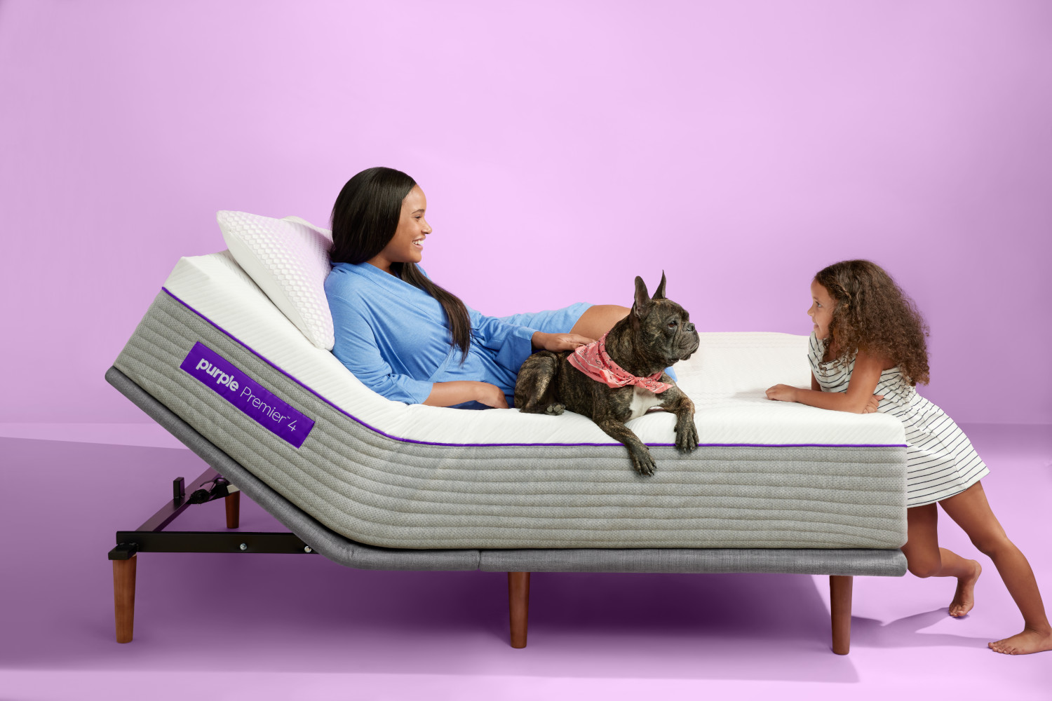 woman and dog laying on Purple Premier 4 Mattress girl leaning on mattress