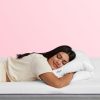 Woman sleeping with hand tucked in The Purple TwinCloudTM Pillow