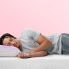 Man sleeping on a Purple Harmony™ Pillow and Purple Mattress