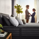 Beautyrest Black Hybrid L-Class lifestyle couple getting dressed
