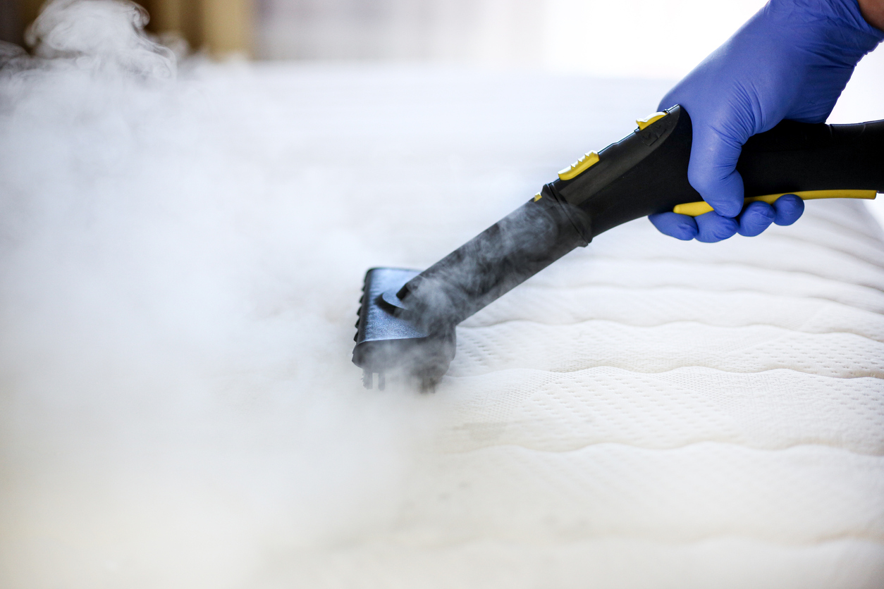 Cleaning and disinfecting the mattress with hot steam.