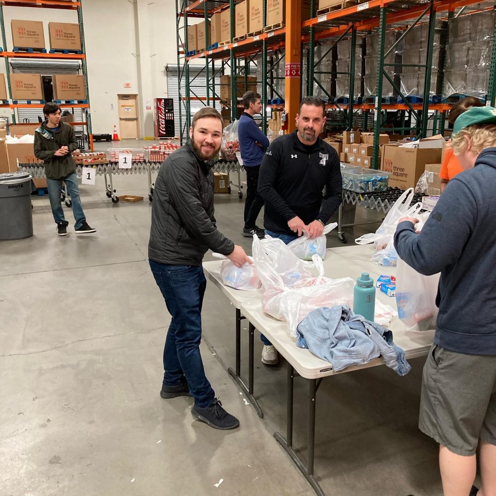 Best Mattress team members packing up food at Three Square in Las Vegas